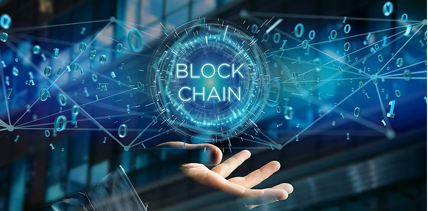 Hand holding text: "Blockchain"